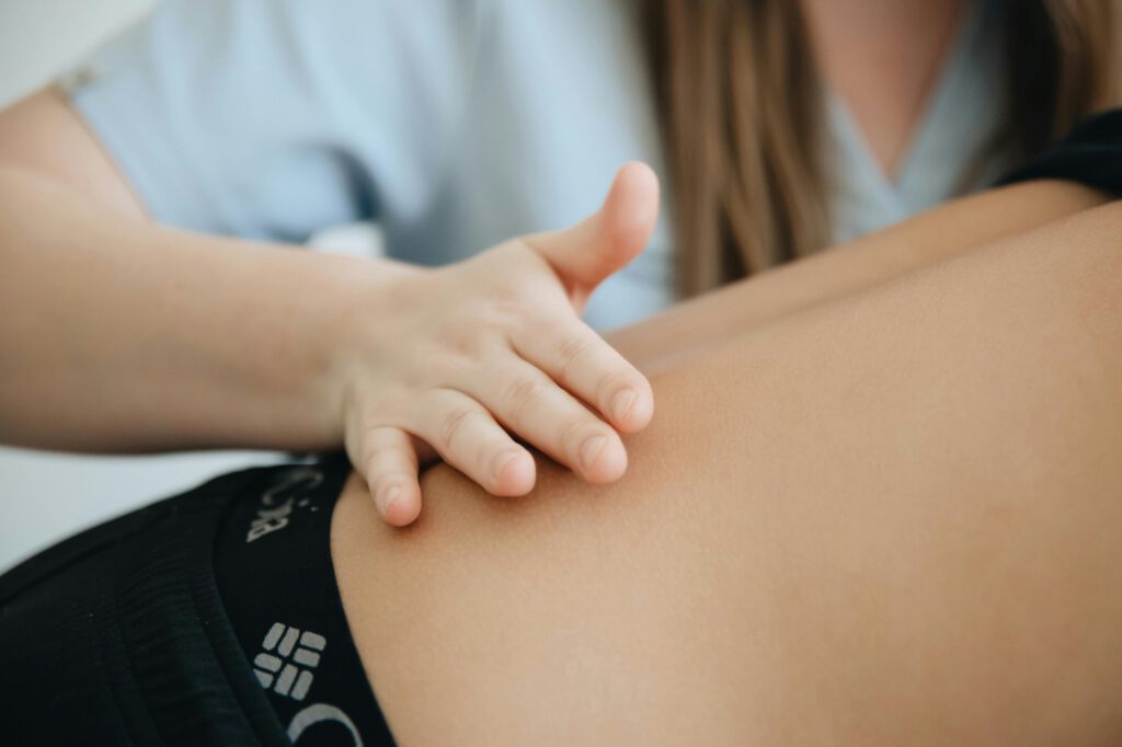 pexels photo 20860601 20860601 Close-up of a physiotherapist providing a back massage to a patient in a clinic.